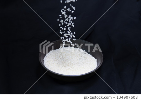 Sticky rice in a bowl on a black background 134907608