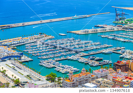 Aerial view of old town Alicante city historic centre, Port of Alicante seaport marina harbor Aerial view of old town Alicante city historic centre, Port of Alicante seaport marina harbor 134907618