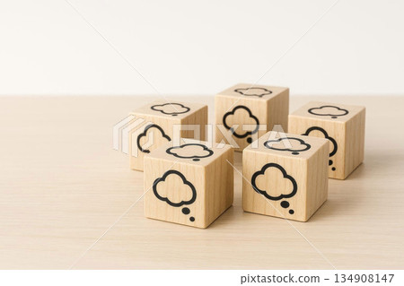 Wooden cubes with clouds of thought on a light background. Space for text. 134908147