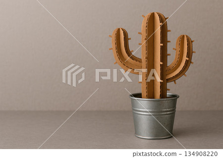 Cardboard cactus in a metal pot on a neutral background. Space for text. Cardboard cactus in a metal pot on a neutral background. Space for text. 134908220