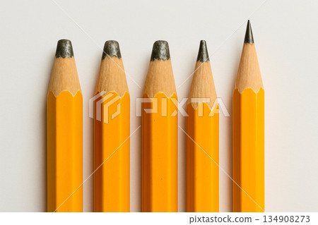 Four dull pencils and one sharpened pencil. Four dull pencils and one sharpened pencil. 134908273