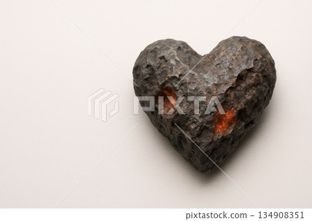 A heart of stone with fiery cracks. Space for text. 134908351