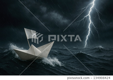 A paper ship sails in a stormy ocean. A paper ship sails in a stormy ocean. 134908424