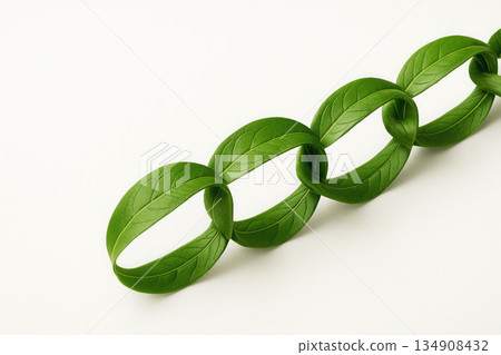 A chain of intertwined green leaves on a light background. Space for text. A chain of intertwined green leaves on a light background. Space for text. 134908432