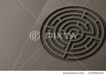 The circular labyrinth is carved into the stone surface. Space for text. The circular labyrinth is carved into the stone surface. Space for text. 134908448