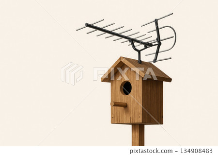 A birdhouse with an antenna as a symbol of connection with nature. Space for text. 134908483