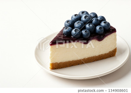 A piece of blueberry cheesecake. Space for text. A piece of blueberry cheesecake. Space for text. 134908601