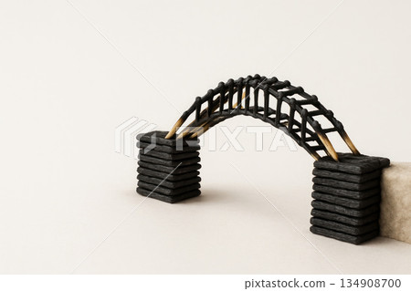 A bridge made of burnt matches between stone piers. Space for text. 134908700