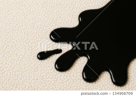 A black stain of liquid is spilled on a light carpet. Space for text. A black stain of liquid is spilled on a light carpet. Space for text. 134908709