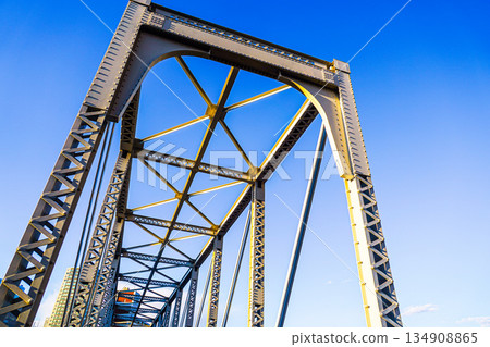 An iron bridge stretching into the blue sky 134908865