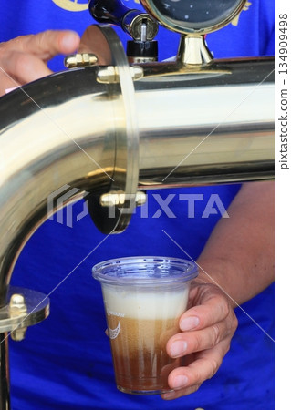 Beer poured from the tap, craft beer, draft beer 134909498