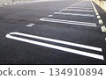 Asphalt-paved pay parking lot 134910894