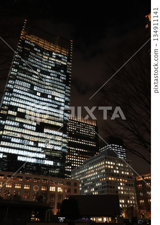 The illuminated JP Tower Building in front of Tokyo Station 134911141