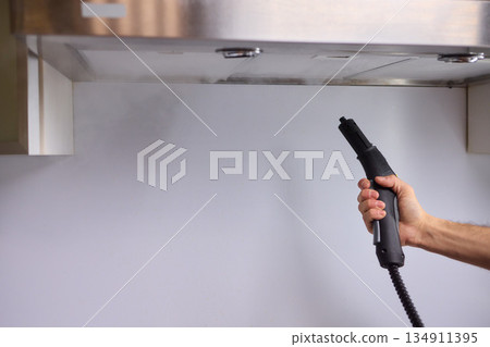 Cleaning the Kitchen Exhaust Hood with a Steamer for Highly Effective Maintenance and Care 134911395