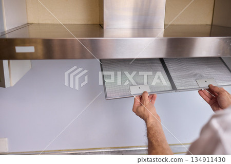 Utilizing Steam Cleaning Techniques on Kitchen Hood Filters for Effective Deep Cleaning Tasks 134911430