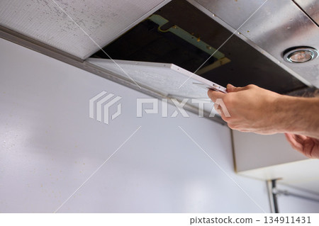 Utilizing Steam Cleaning Techniques on Kitchen Hood Filters for Effective Deep Cleaning Tasks 134911431