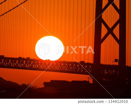 Sunset and mighty suspension bridge 134912010