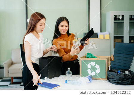 Eco friendly teamwork with this office recycling scene. Perfect for showcasing sustainability, collaboration, Eco friendly teamwork with this office recycling scene. Perfect for showcasing sustainability, collaboration, 134912232