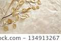 A gold leaf design is on a white bedspread 134913267