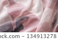 A piece of fabric with a pattern of pink and black 134913278