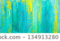 A painting of a blue and yellow background with a green stripe 134913280