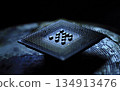 A detailed close-up of a computer microchip highlighting its intricate pins and circuits on a sleek metallic surface 134913476
