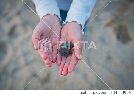 A pumice stone gently placed in the palm of my hand | A small discovery I found on the beach 134913999