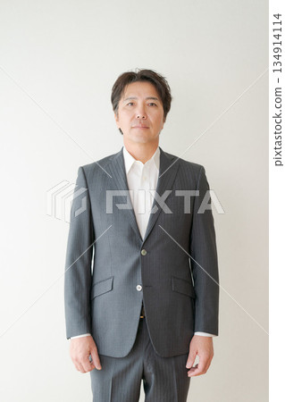A man in his 50s in a suit A man in his 50s in a suit 134914114