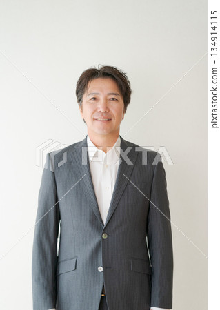 A man in his 50s in a suit A man in his 50s in a suit 134914115
