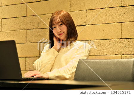 Businesswoman working on a laptop in the office 134915171