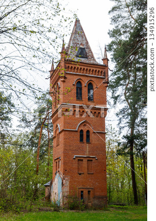 Old brick water tower in Natalyevka park in Kharkiv region, Ukraine 134915296