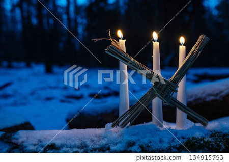 Saint Brigids Cross Irish pagan symbol with daisy of house blessing protection from evil and fire. Saint Brigids Cross Irish pagan symbol with daisy of house blessing protection from evil and fire. 134915793