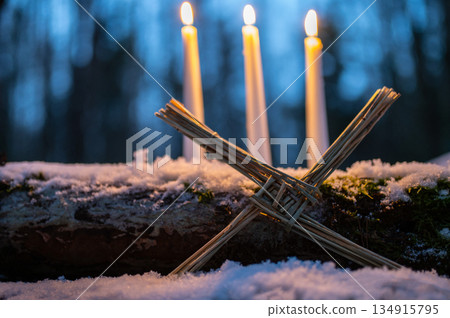 Saint Brigids Cross Irish pagan symbol with daisy of house blessing protection from evil and fire. Saint Brigids Cross Irish pagan symbol with daisy of house blessing protection from evil and fire. 134915795