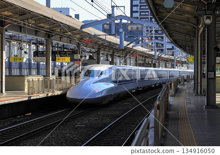 The SHINKANSEN train approached the platform to take up passengers at shinkansen train Station. 134916050