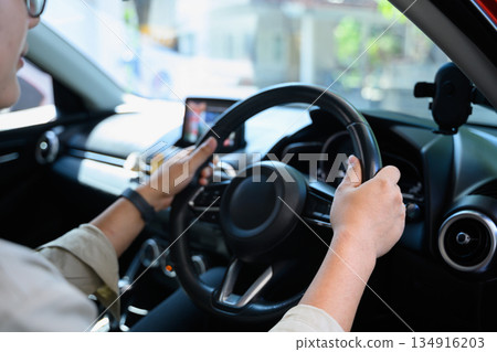 Closeup man driving a car Closeup man driving a car 134916203
