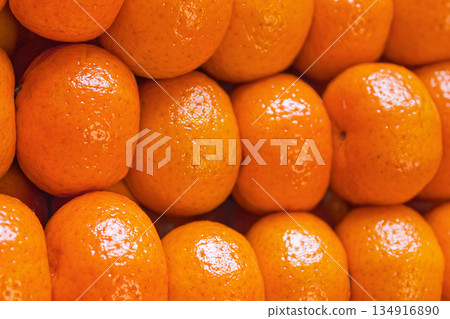 Fresh tangerines in boxes on the shelves of a grocery supermarket, tangerines on the shelves of a grocery store 134916890
