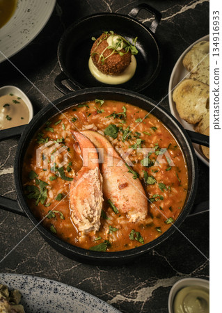 Portuguese traditional food Crab soup risotto meal on restaurant table in lisbon Portuguese traditional food Crab soup risotto meal on restaurant table in lisbon 134916933
