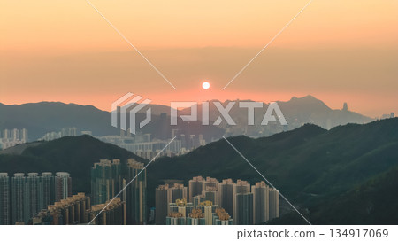Hong Kong skyline glowing in warm golden light Dec 28 2025 134917069