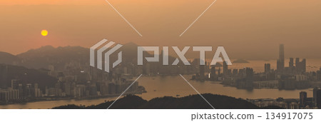 Hong Kong skyline glowing in warm golden light Dec 28 2021 Hong Kong skyline glowing in warm golden light Dec 28 2021 134917075