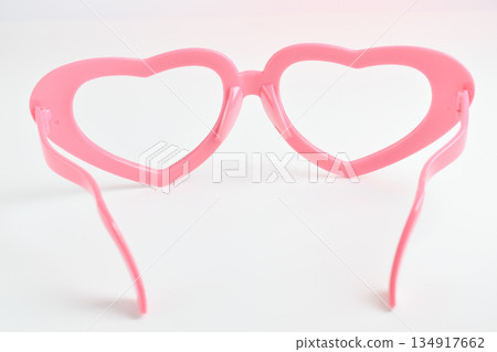 pink heart shape of glasses on white background 134917662