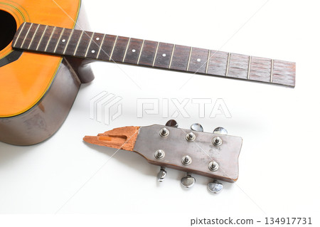 part of broken wood acoustic guitar isolated on white background 134917731