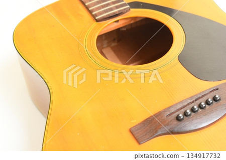 brown wood acoustic guitar isolated on white background 134917732