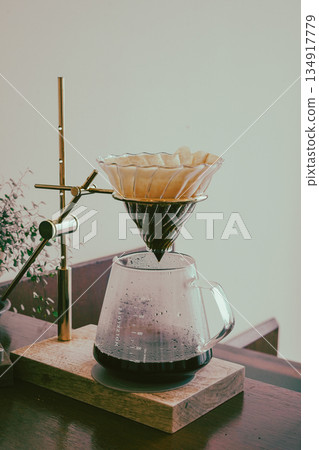 Hand Drip Coffee Extracting into Glass Server Hand Drip Coffee Extracting into Glass Server 134917779