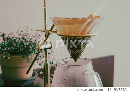 Coffee Dripping Through Paper Filter Coffee Dripping Through Paper Filter 134917781