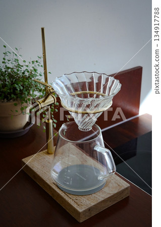 Clear Glass Coffee Dripper on Wooden Stand 134917788