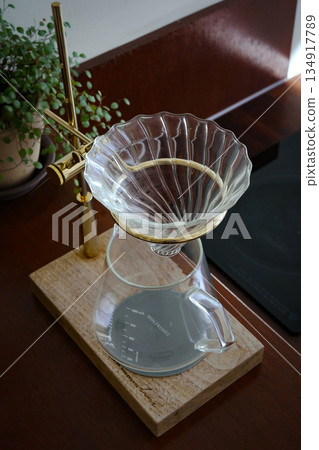 Clear Glass Coffee Dripper on Wooden Stand Clear Glass Coffee Dripper on Wooden Stand 134917789