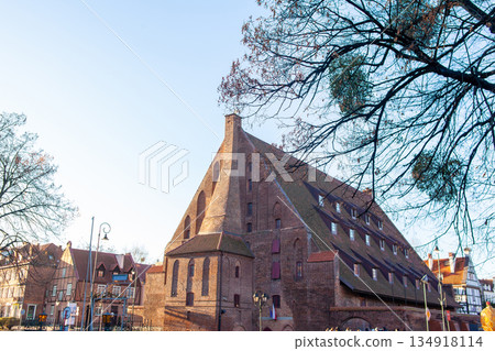 Historic building stands in the town square during a clear day in autumn Historic building stands in the town square during a clear day in autumn 134918114