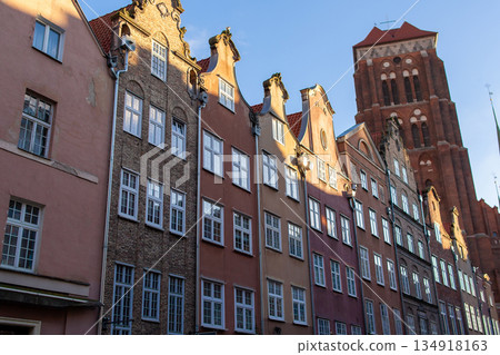 Historic buildings line the street in Gdansk, Poland during evening light 134918163