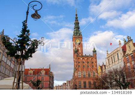 Clock tower in Gdansk highlights city architecture during cloudy day 134918169