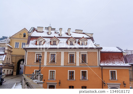 Historic building with snow on the roof in a city square during winter Historic building with snow on the roof in a city square during winter 134918172